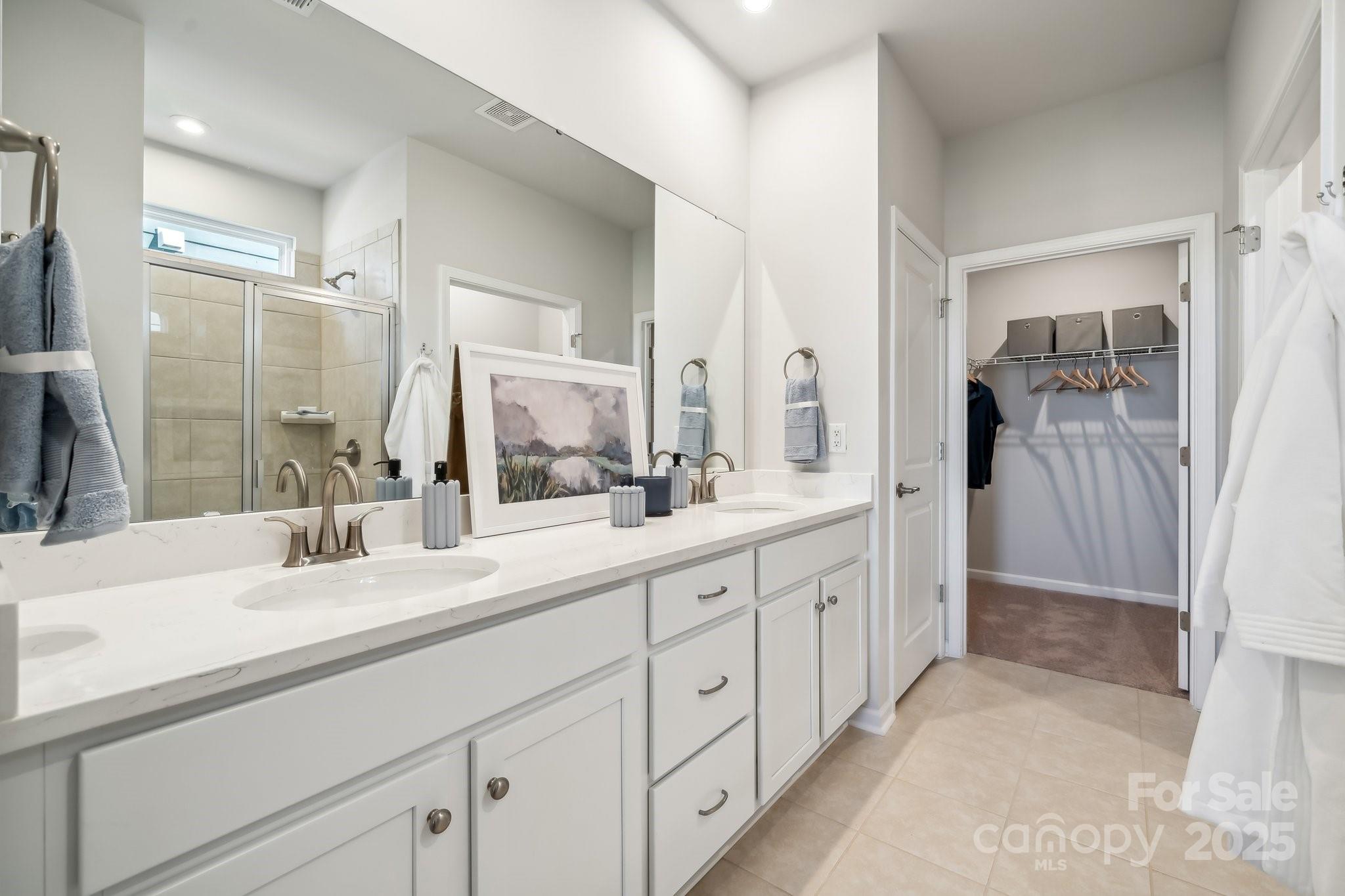 1088 Arundle Road Sherrills Ford, NC 28673 - Photo 5 of 31 a bathroom with a double vanity sink mirror and shower