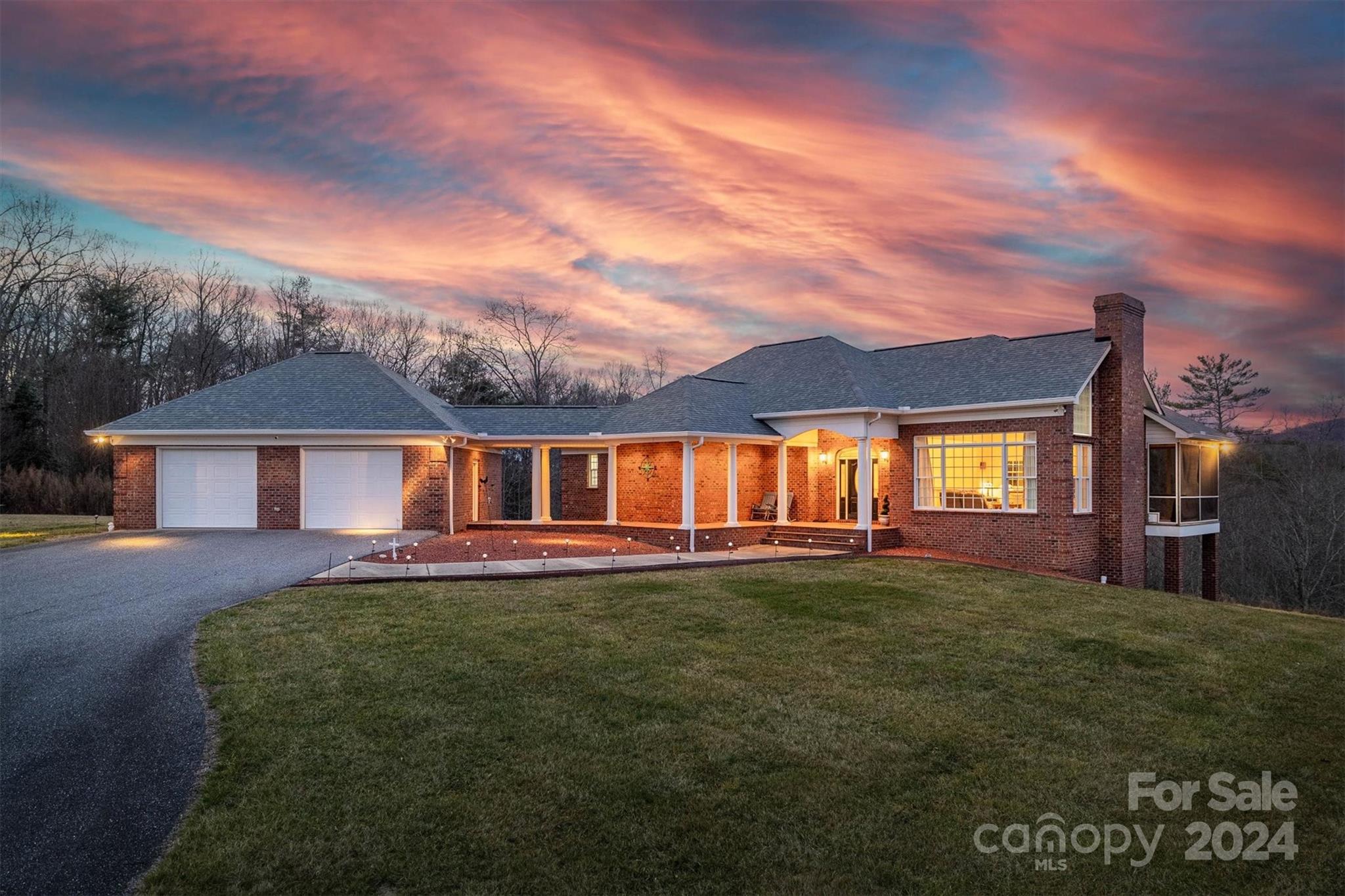 3292 Deal Mill Road Hudson, NC 28638 - Photo 1 of 44 a front view of a house with a garden