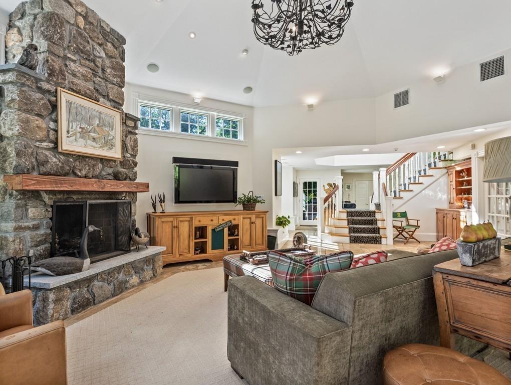 101 Abbott Road Wellesley, MA 02481 - Photo 19 of 38 a living room with fireplace furniture and a flat screen tv