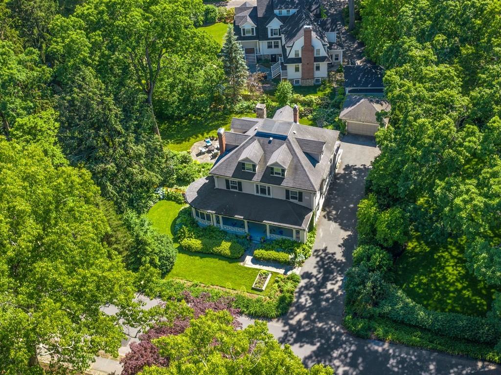 101 Abbott Road Wellesley, MA 02481 - Photo 2 of 38 an aerial view of a house with a big yard and large trees
