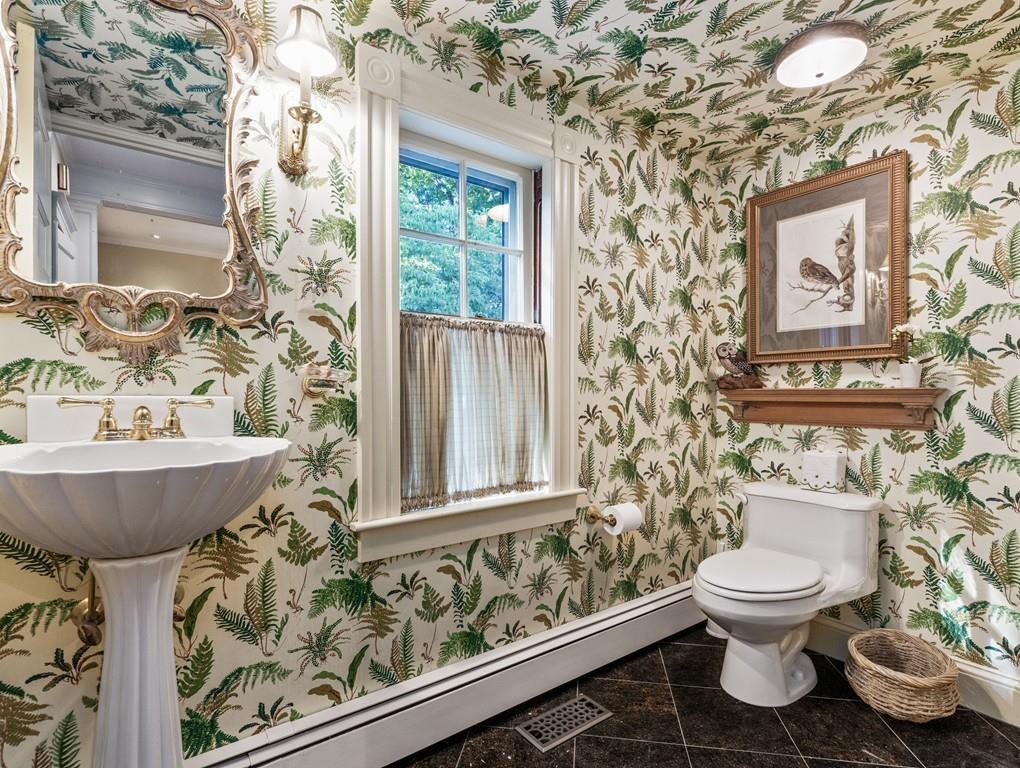 101 Abbott Road Wellesley, MA 02481 - Photo 21 of 38 a bathroom with a toilet sink and mirror