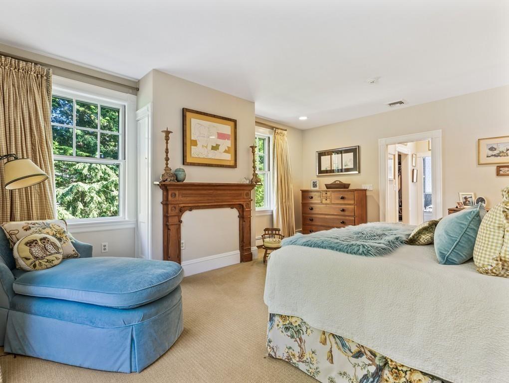 101 Abbott Road Wellesley, MA 02481 - Photo 23 of 38 a bedroom with a bed and a couch