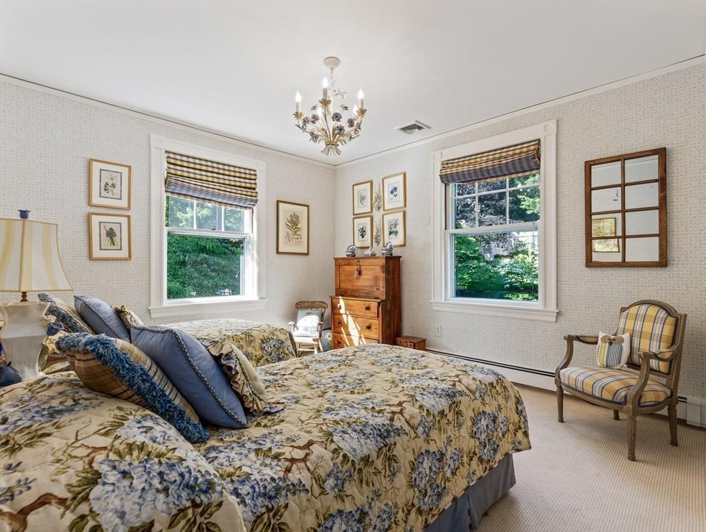 101 Abbott Road Wellesley, MA 02481 - Photo 27 of 38 a bedroom with a bed and a window