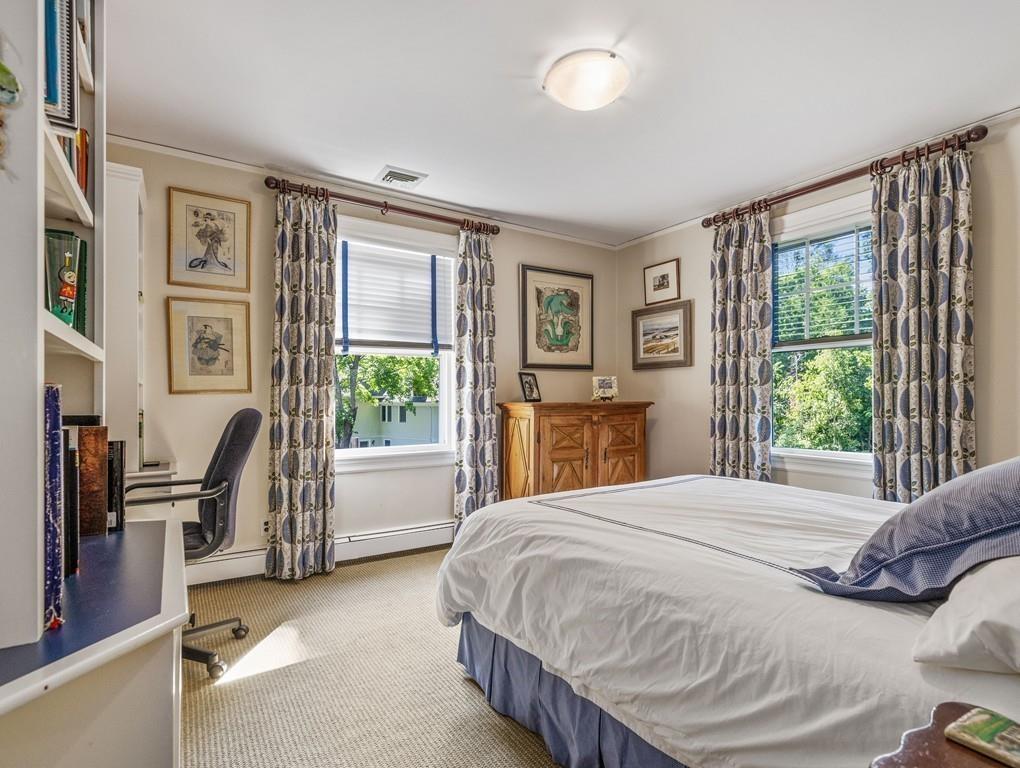 101 Abbott Road Wellesley, MA 02481 - Photo 28 of 38 a bedroom with a bed large window with table and chair