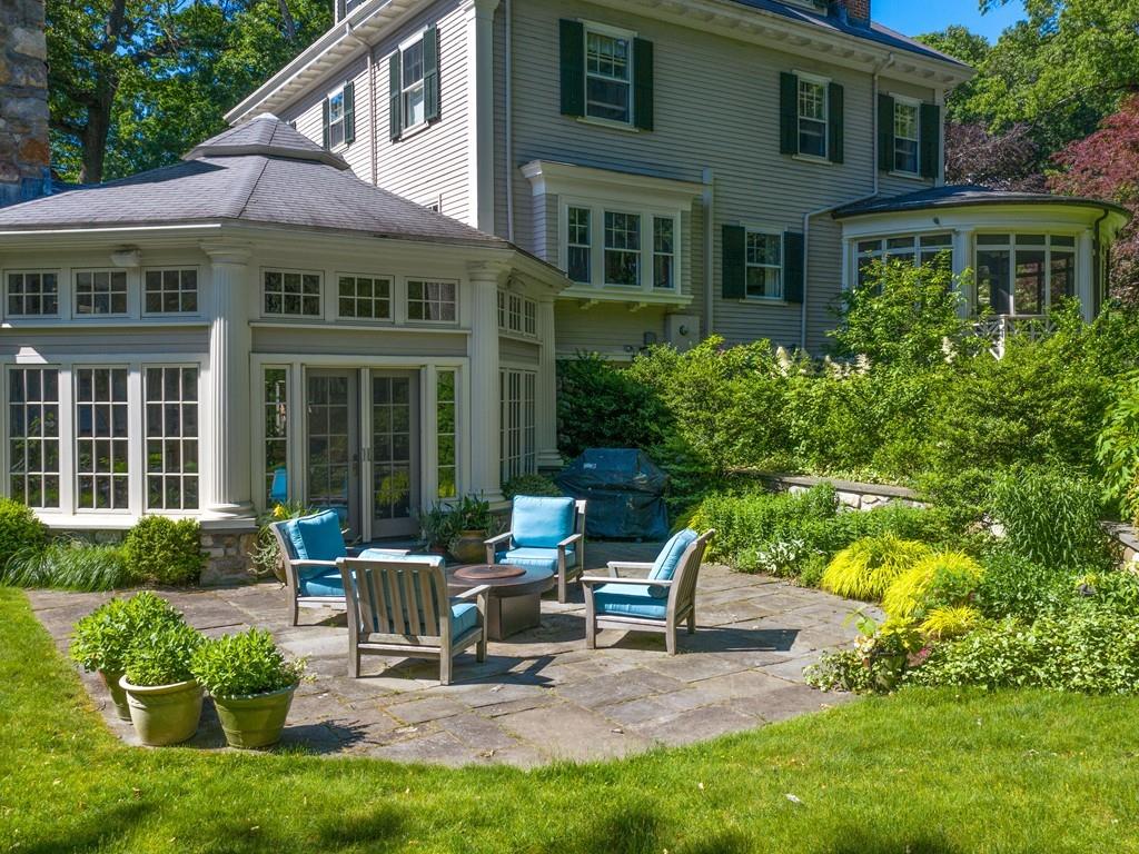 101 Abbott Road Wellesley, MA 02481 - Photo 4 of 38 a view of a house with backyard sitting area and garden