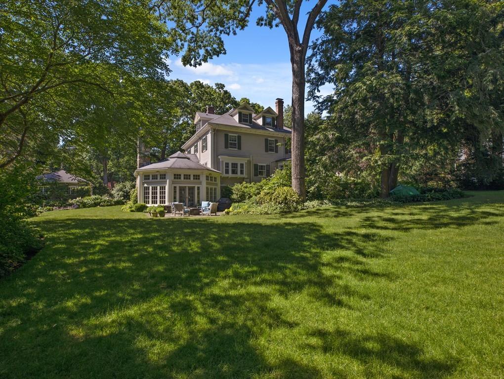 101 Abbott Road Wellesley, MA 02481 - Photo 5 of 38 a front view of a house with a yard