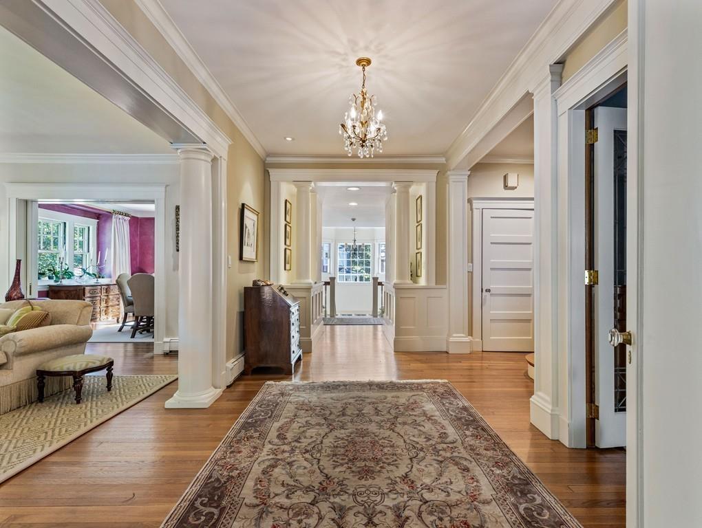 101 Abbott Road Wellesley, MA 02481 - Photo 9 of 38 a living room with furniture and a chandelier
