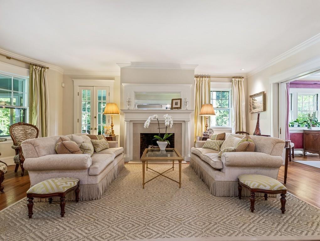 101 Abbott Road Wellesley, MA 02481 - Photo 10 of 38 a living room with furniture and a fireplace