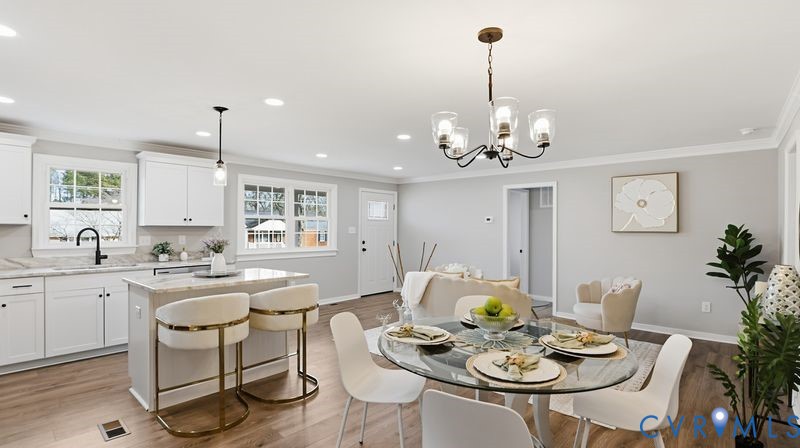 25209 Ritchie Avenue Petersburg, VA 23803 - Photo 7 of 50 a dining room with furniture a chandelier and kitchen view