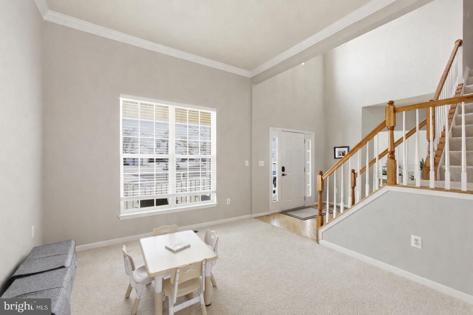 13119 Bigleaf Maple Court Gainesville, VA 20155 - Photo 12 of 36 a view of a livingroom with furniture and stairs