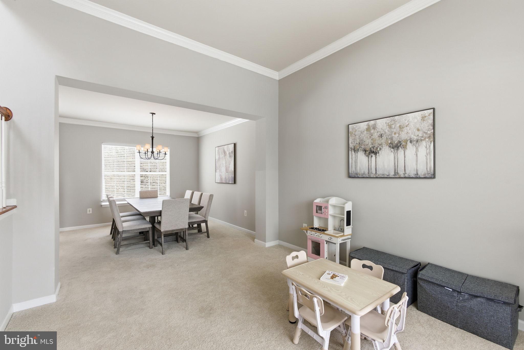 13119 Bigleaf Maple Court Gainesville, VA 20155 - Photo 13 of 36 a living room with furniture and a window