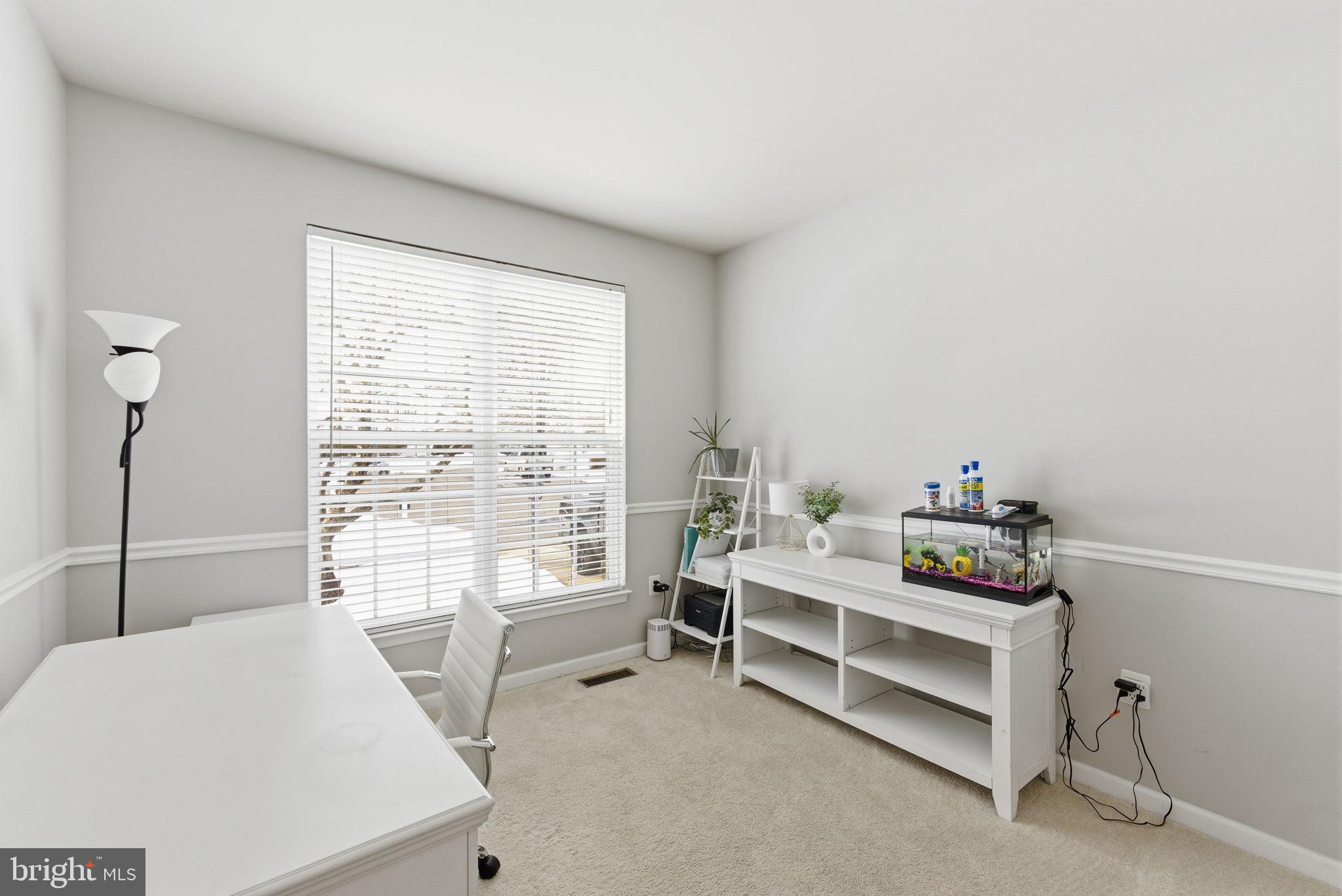 13119 Bigleaf Maple Court Gainesville, VA 20155 - Photo 14 of 36 a bedroom with furniture and a window