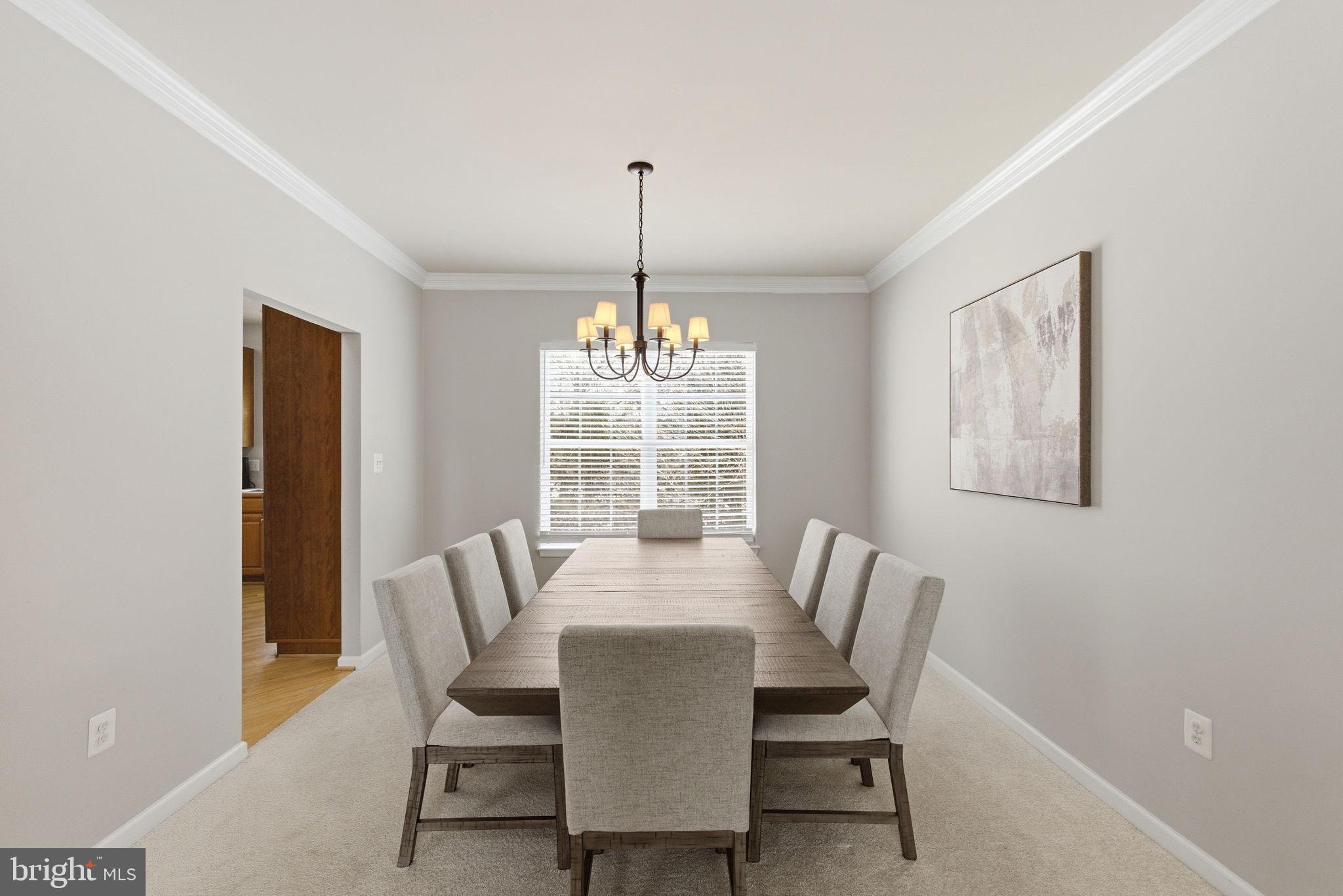 13119 Bigleaf Maple Court Gainesville, VA 20155 - Photo 15 of 36 a dining room with furniture a chandelier and window