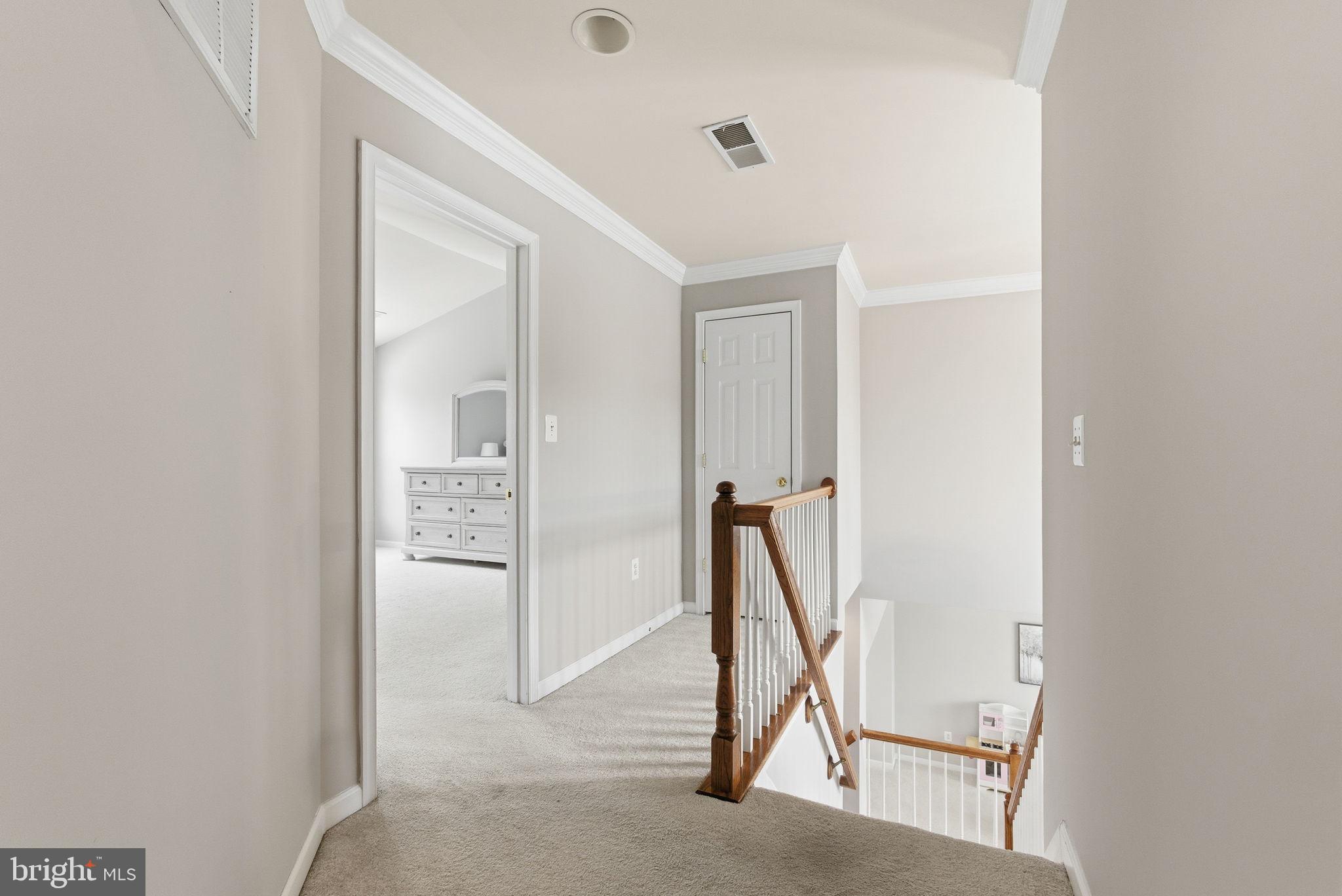 13119 Bigleaf Maple Court Gainesville, VA 20155 - Photo 20 of 36 a view of an entryway with table
