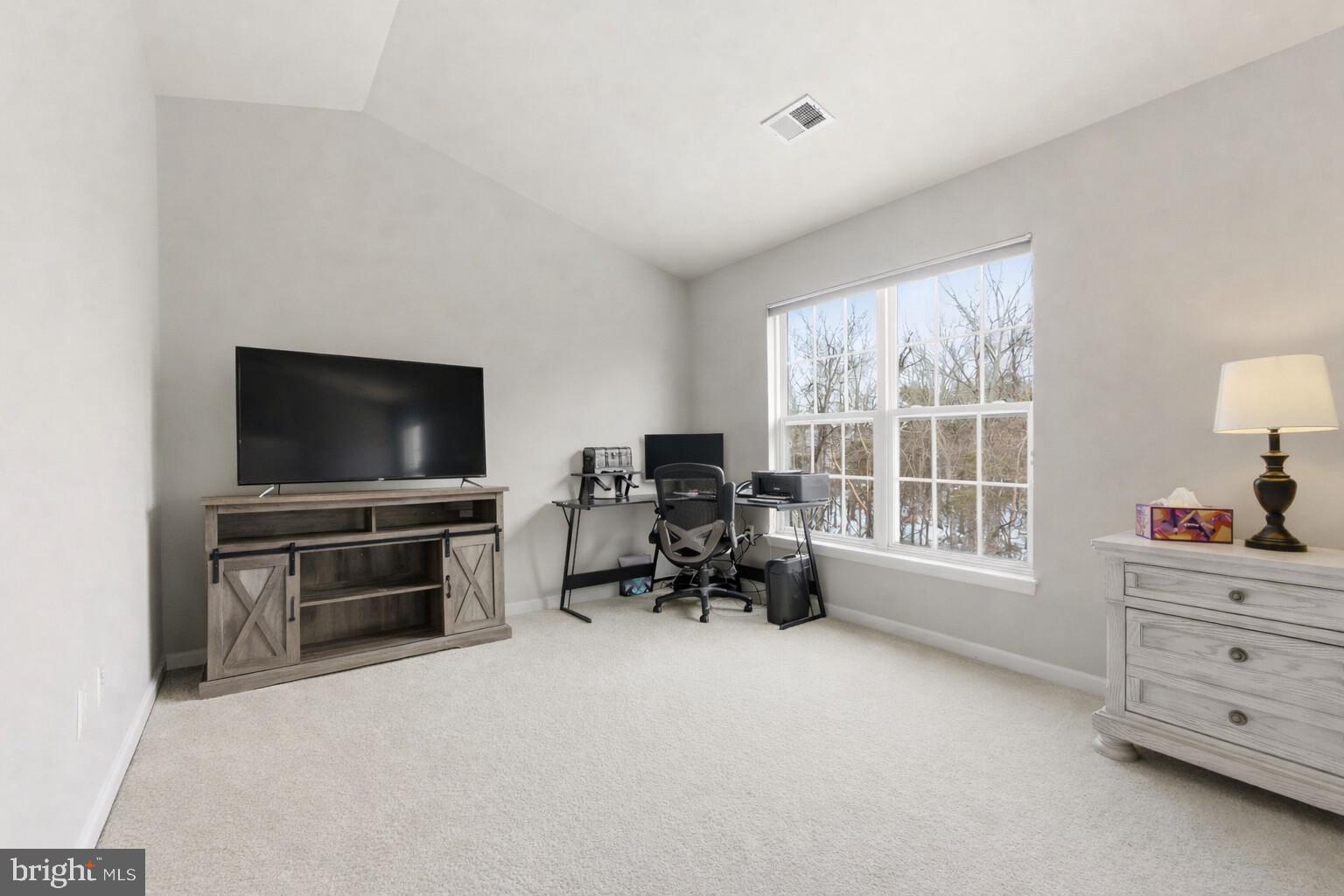 13119 Bigleaf Maple Court Gainesville, VA 20155 - Photo 23 of 36 a living room with furniture and a flat screen tv