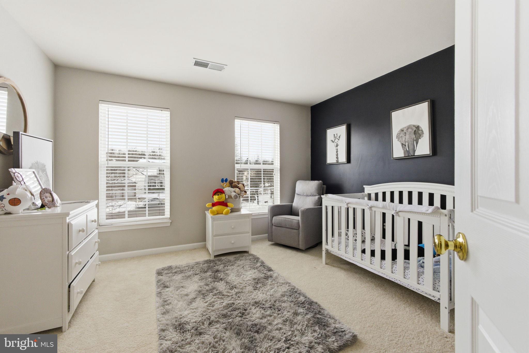 13119 Bigleaf Maple Court Gainesville, VA 20155 - Photo 28 of 36 a bedroom with furniture and windows
