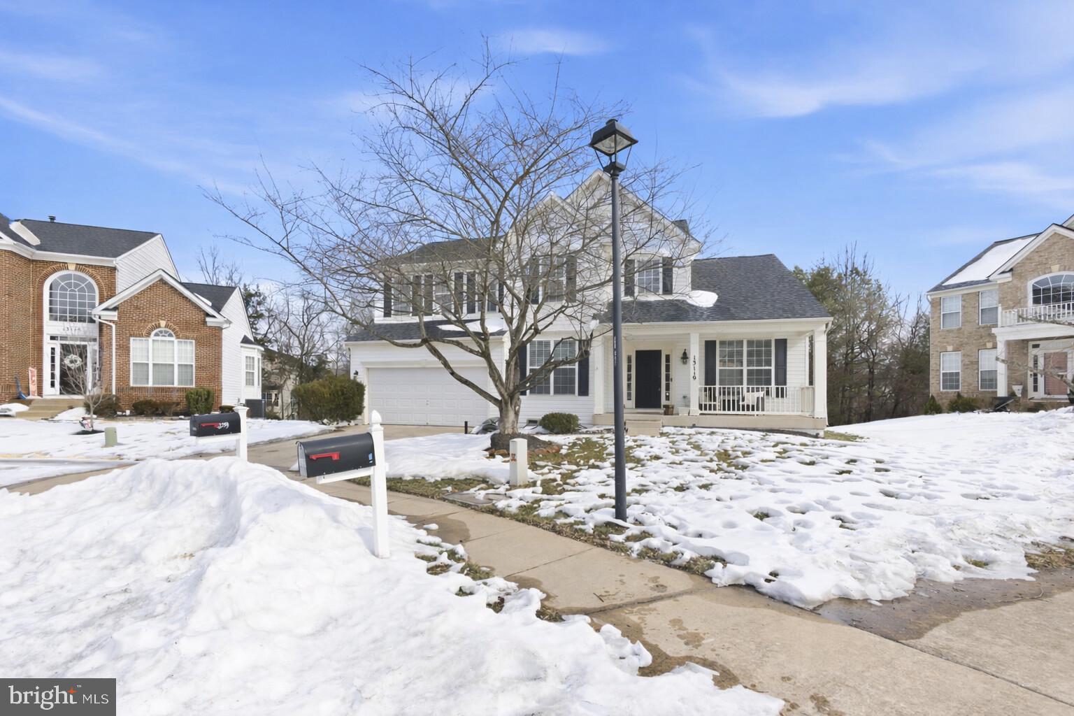 13119 Bigleaf Maple Court Gainesville, VA 20155 - Photo 3 of 36 a front view of a house with a yard