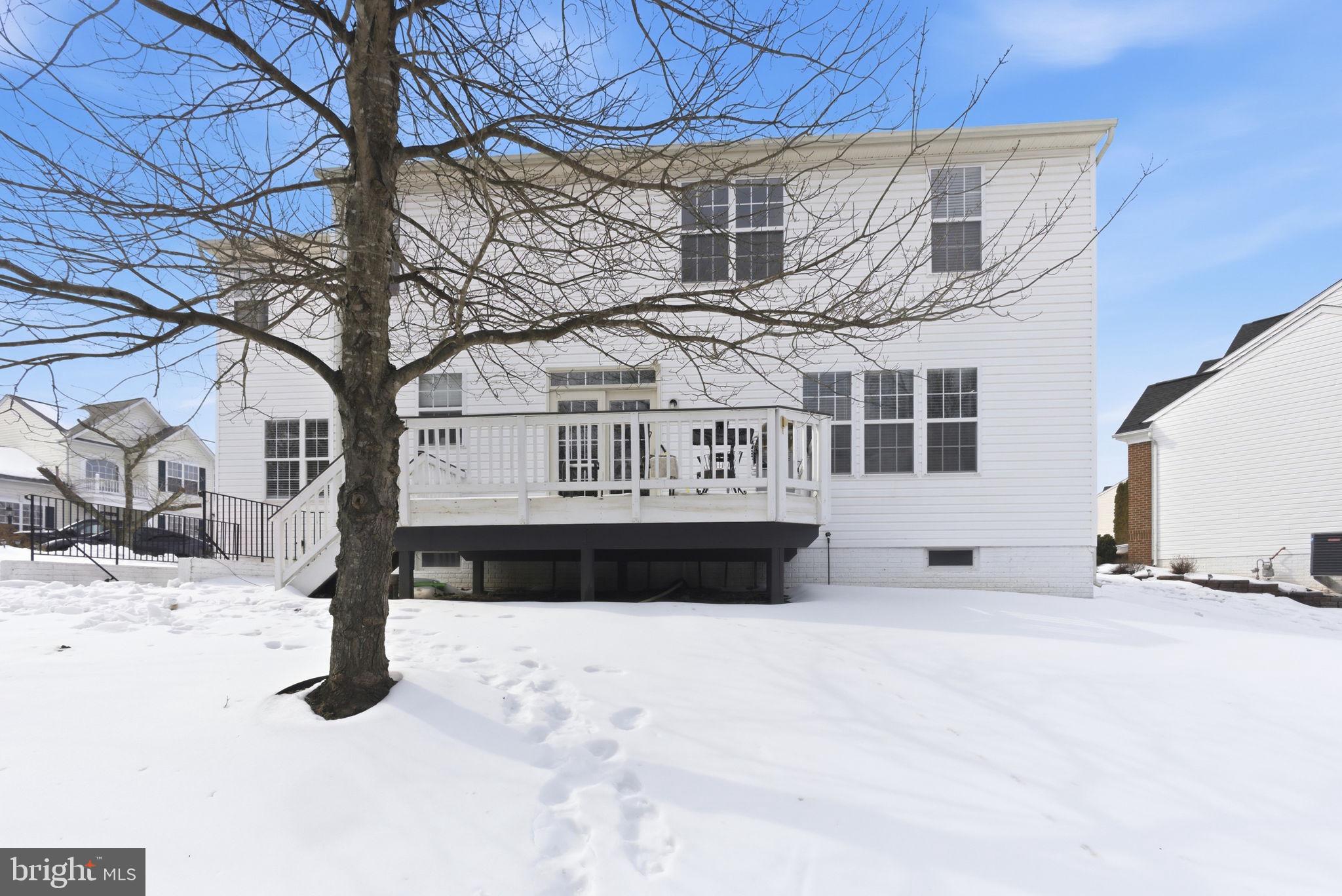 13119 Bigleaf Maple Court Gainesville, VA 20155 - Photo 34 of 36 a front view of a house with a yard