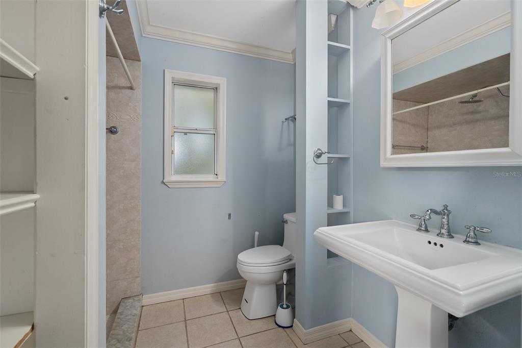 744 Cornwall Road Winter Park, FL 32792 - Photo 14 of 57 a bathroom with a sink a toilet and mirror