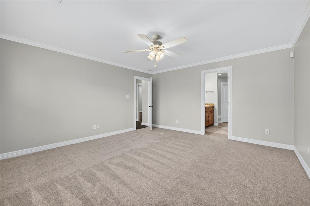 4814 Hilre Drive Sherman, TX 75092 - Photo 14 of 27 a view of an empty room with a ceiling fan