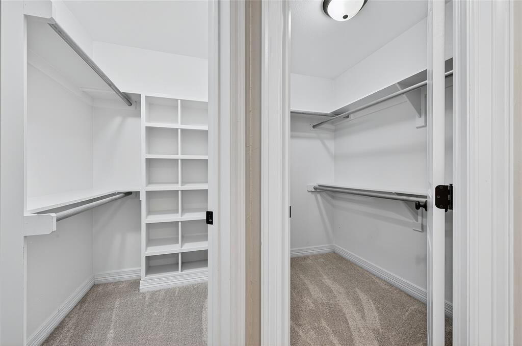 4814 Hilre Drive Sherman, TX 75092 - Photo 19 of 27 a view of walk in closet with empty racks