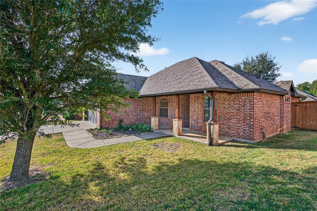 4814 Hilre Drive Sherman, TX 75092 - Photo 2 of 27 a front view of a house with garden