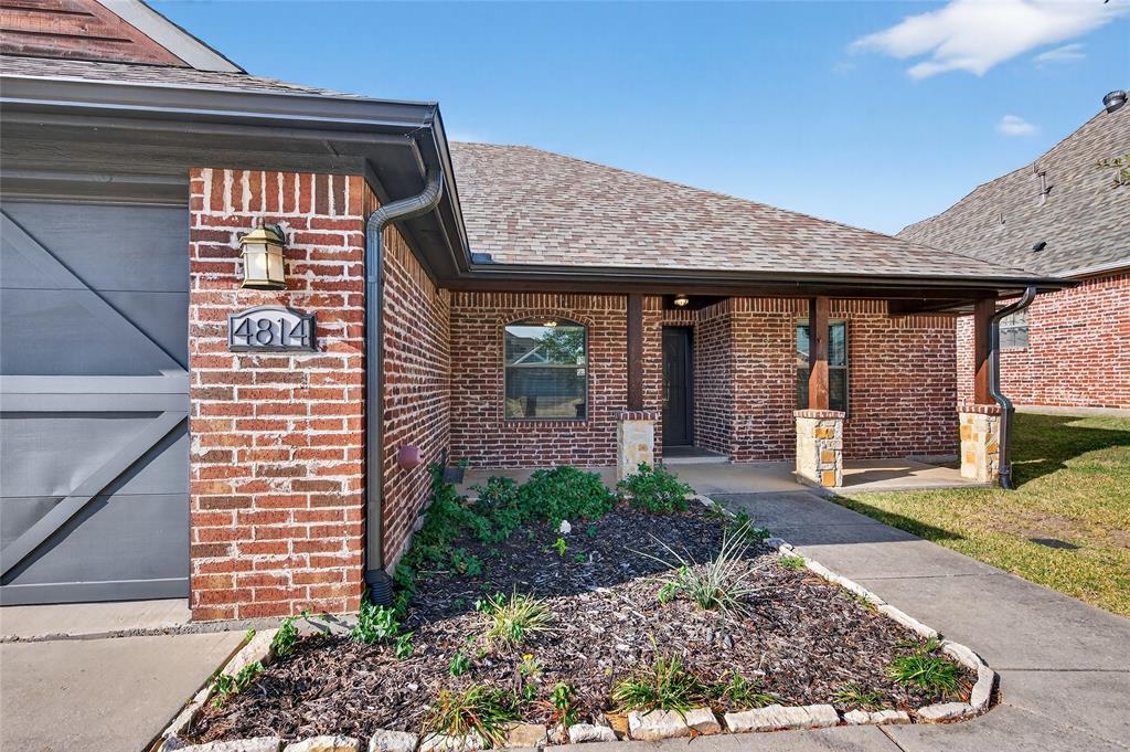 4814 Hilre Drive Sherman, TX 75092 - Photo 3 of 27 a front view of a house with garden