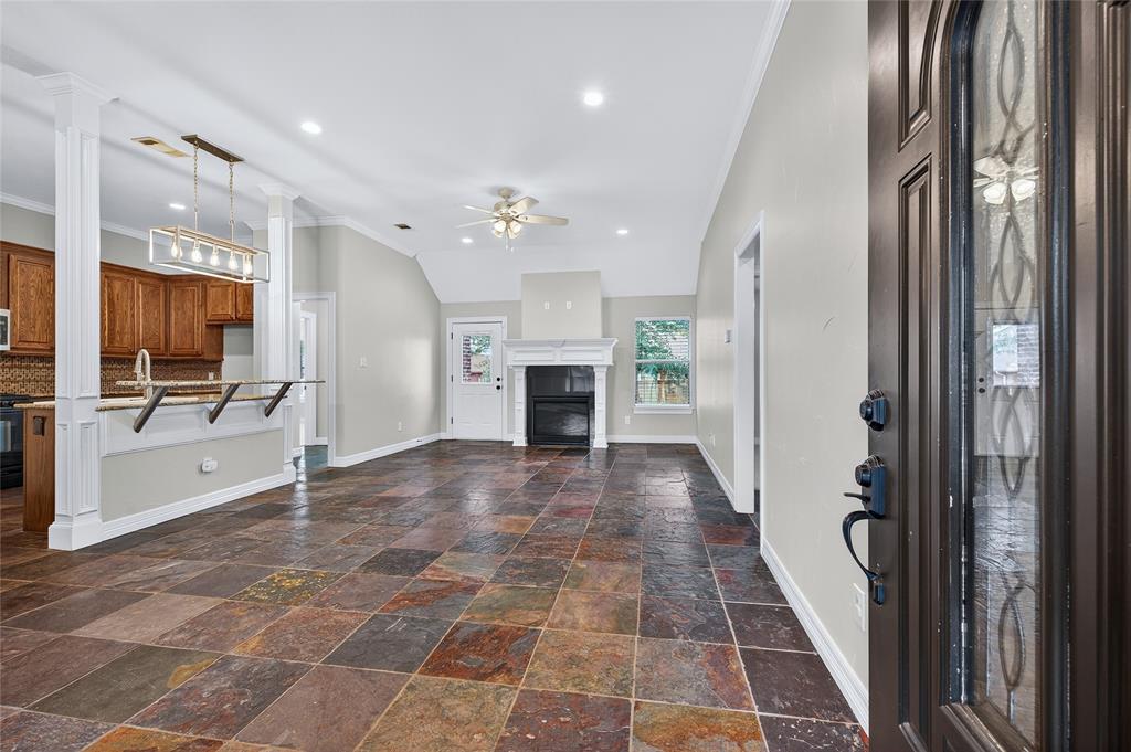 4814 Hilre Drive Sherman, TX 75092 - Photo 4 of 27 a view of a hallway with furniture and a fireplace