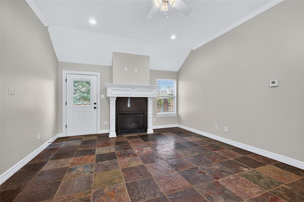 4814 Hilre Drive Sherman, TX 75092 - Photo 5 of 27 an empty room with windows and fireplace