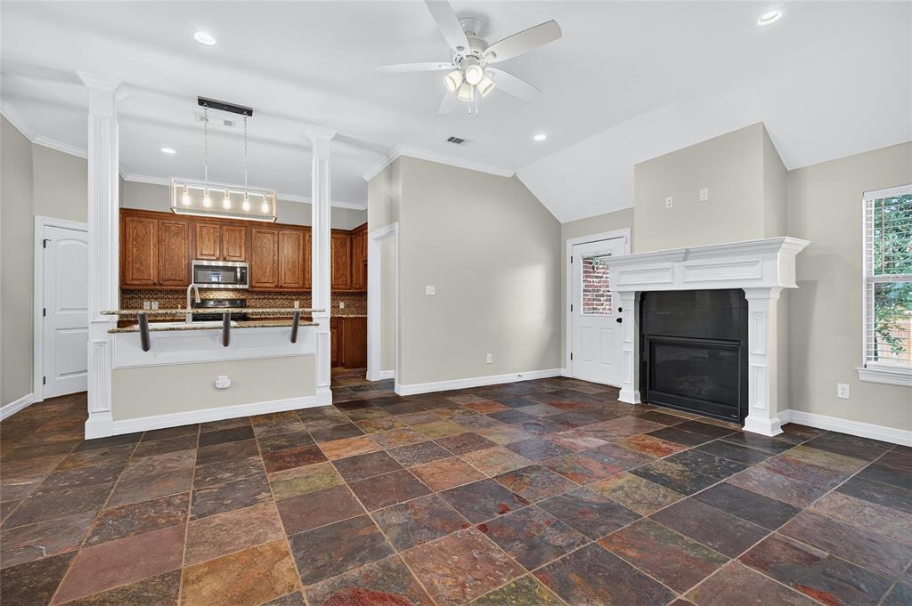 4814 Hilre Drive Sherman, TX 75092 - Photo 6 of 27 a view of a kitchen with a sink and a fireplace