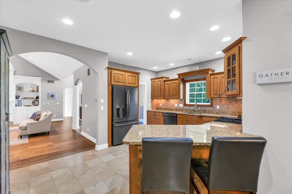 a kitchen with a refrigerator and a sink