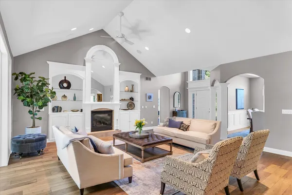 a living room with furniture and a fireplace