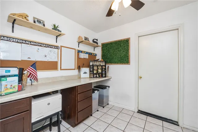 a kitchen with a sink cabinets and window