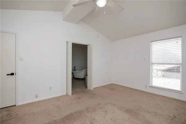 an empty room with a bathroom