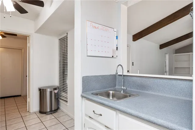 a kitchen with a sink and a microwave