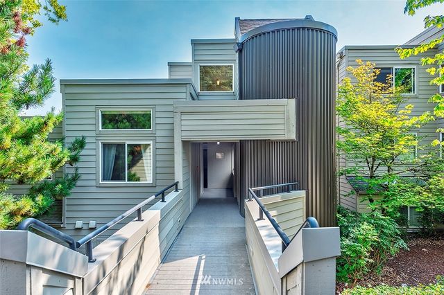 a view of house with backyard and garden