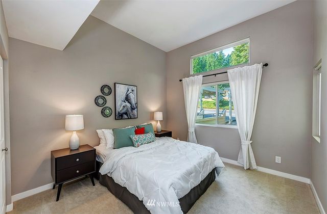 a bedroom with a bed and a couch