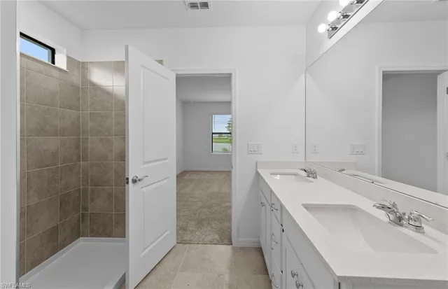 $319,990 | 630 Lakeside Oasis Avenue, Lehigh Acres, FL 33974