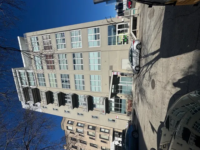 a view of balcony with furniture and wooden floor