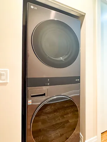 a view of a balcony with wooden floor and outdoor seating