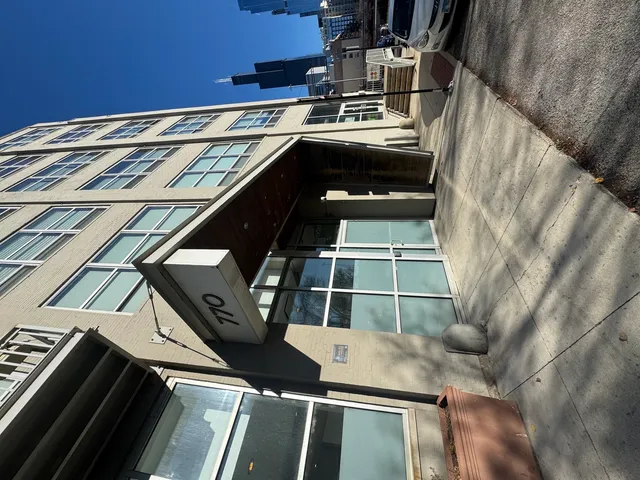 a living room with a sink and gym equipment