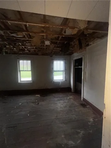 a view of front door and porch with furniture