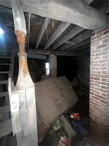 a kitchen with granite countertop a stove and a wooden floor