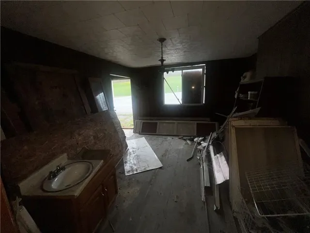 a room with furniture and flat screen tv