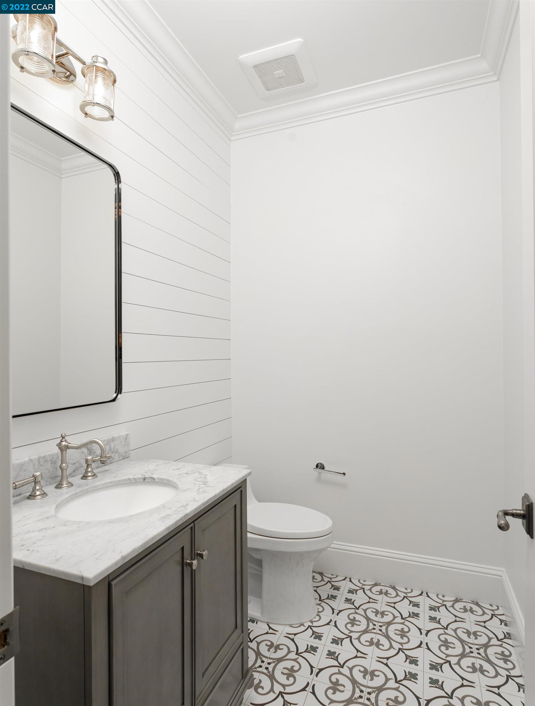 962 Reliez Station Lane Lafayette, CA 94549 - Photo 19 of 25 a bathroom with a sink a toilet and a mirror