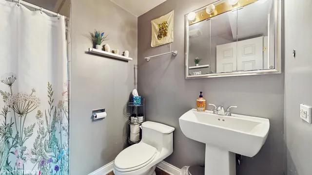 a spacious bathroom with a granite countertop tub sink and mirror