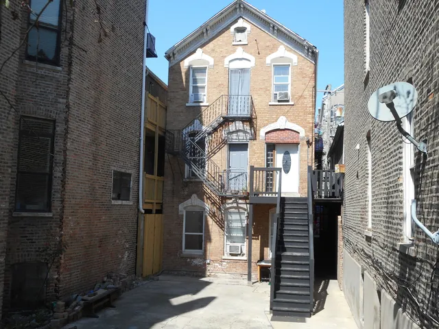 a front view of a house with large windows