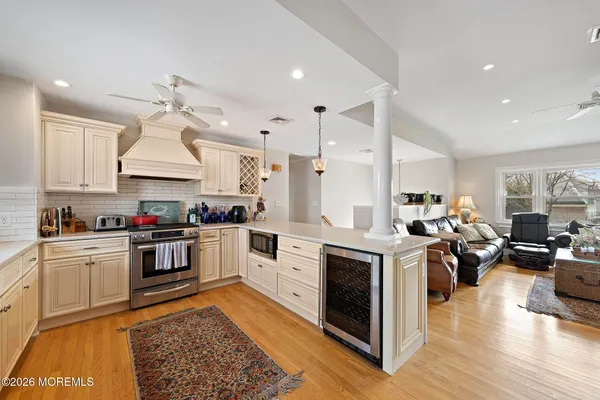 a kitchen with stove top oven and refrigerator