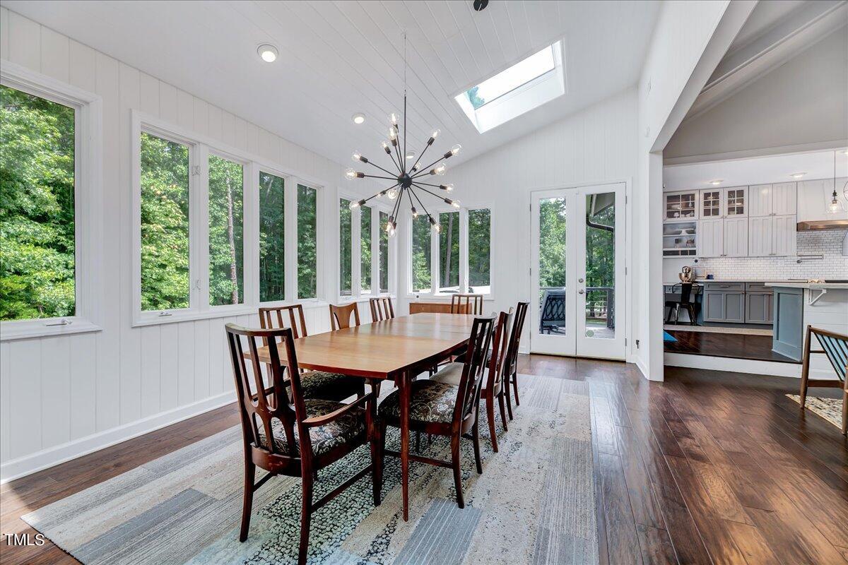11313 Rumshill Road Raleigh, NC 27614 - Photo 11 of 55 a view of a dining room with furniture window and wooden floor