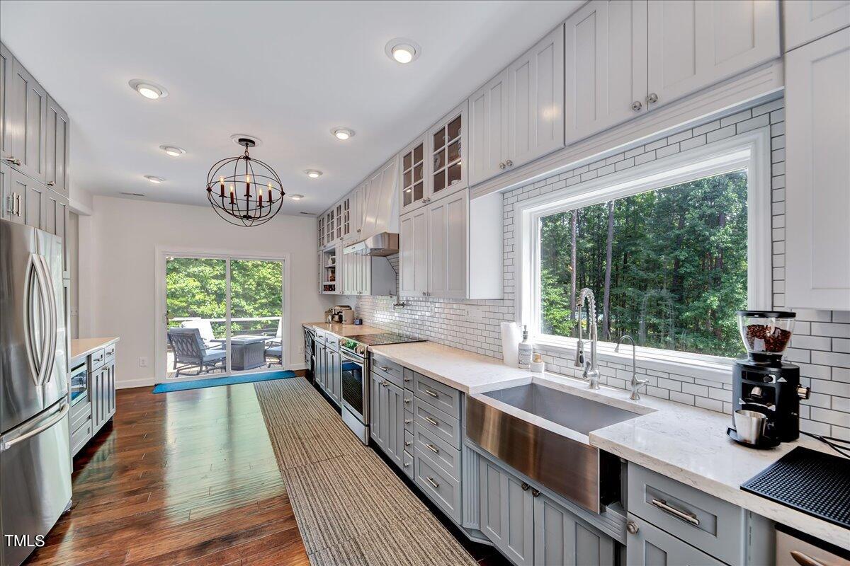 11313 Rumshill Road Raleigh, NC 27614 - Photo 18 of 55 a kitchen with a large window in it and kitchen island